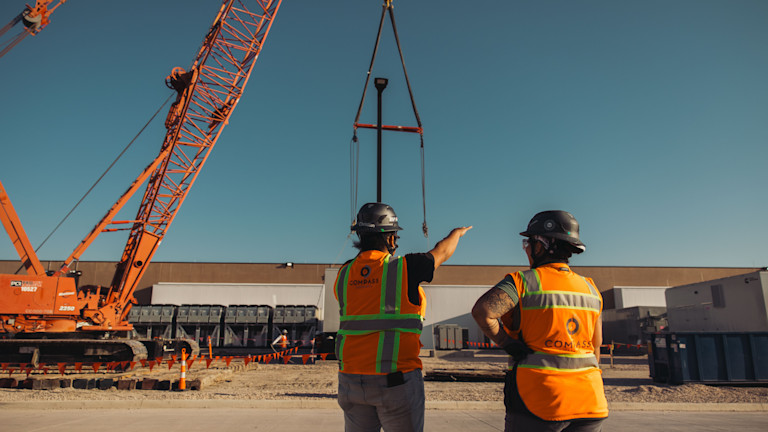 Compass Datacenters Employees in front of a datacenter build