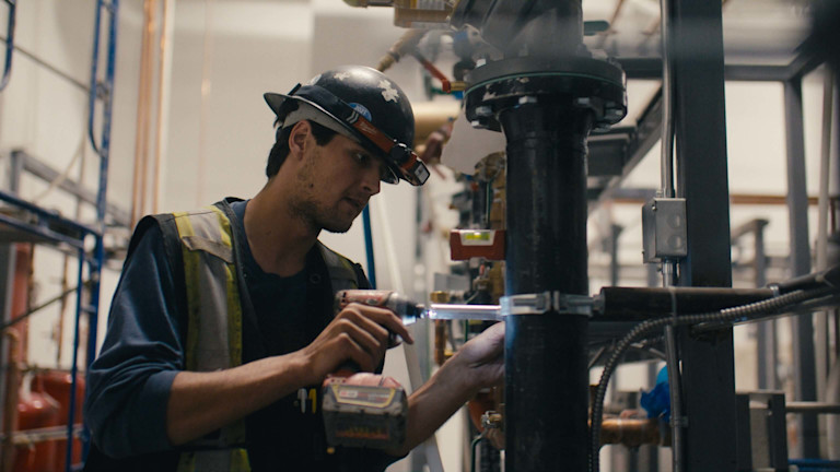 Pitt Meadows employee working on pipes