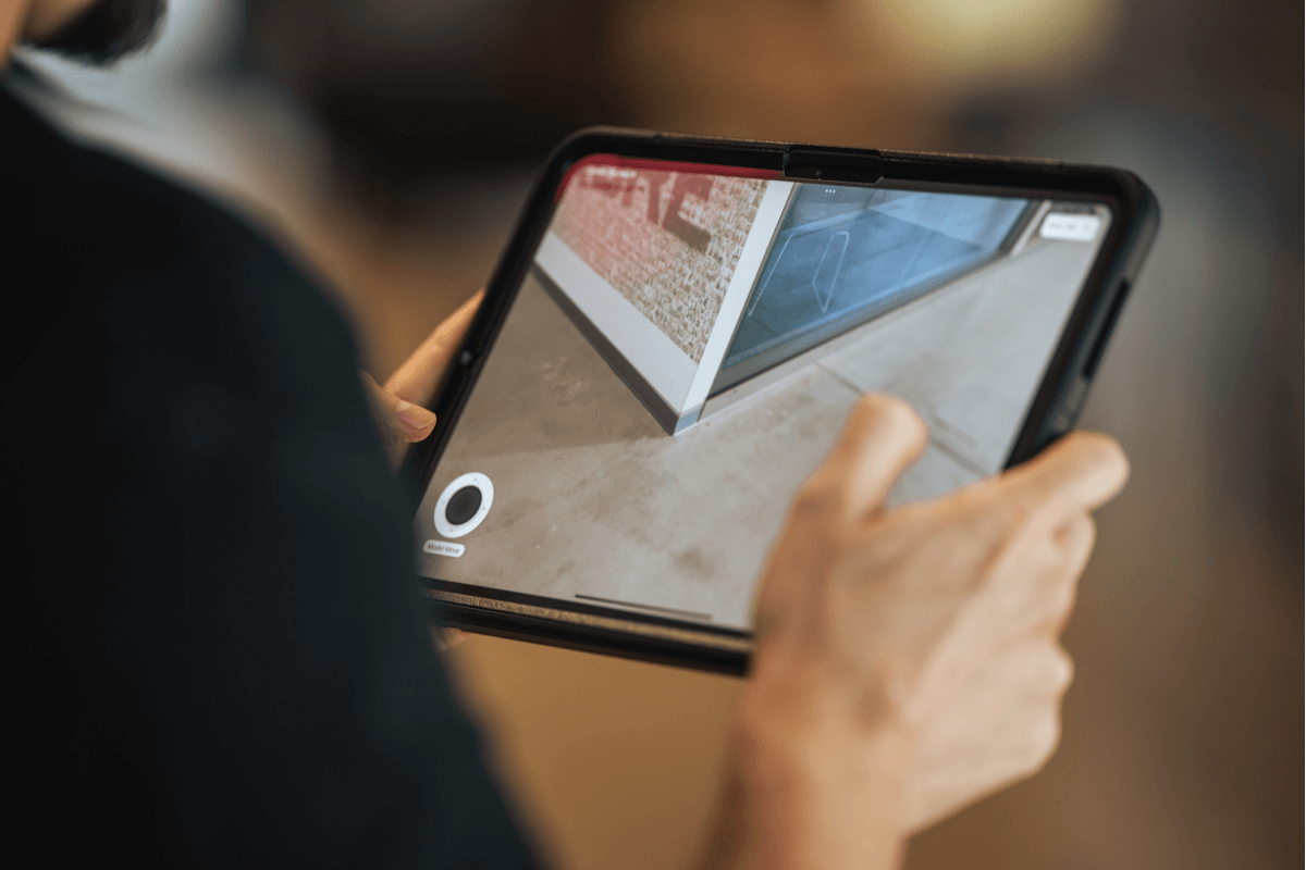 Worker review plans on a tablet